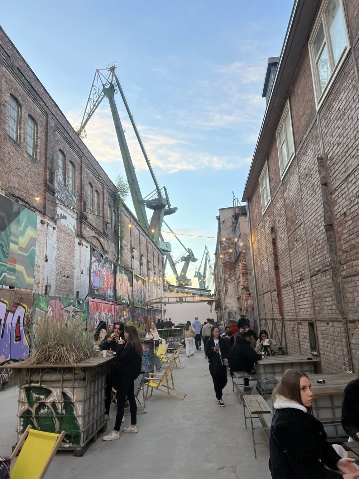 Murals and shipyard cranes in Gdańsk